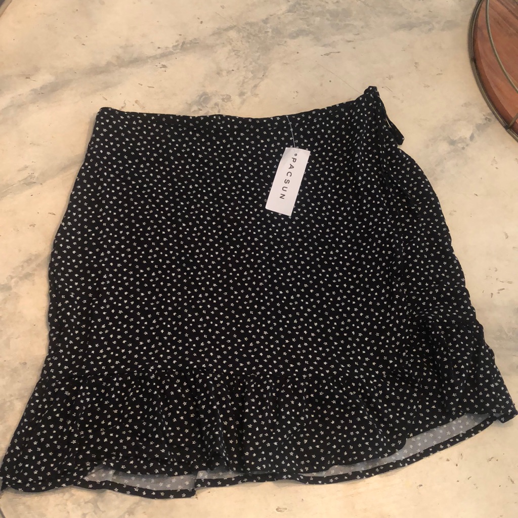 Black Ruffle Skirt With Flowers On It